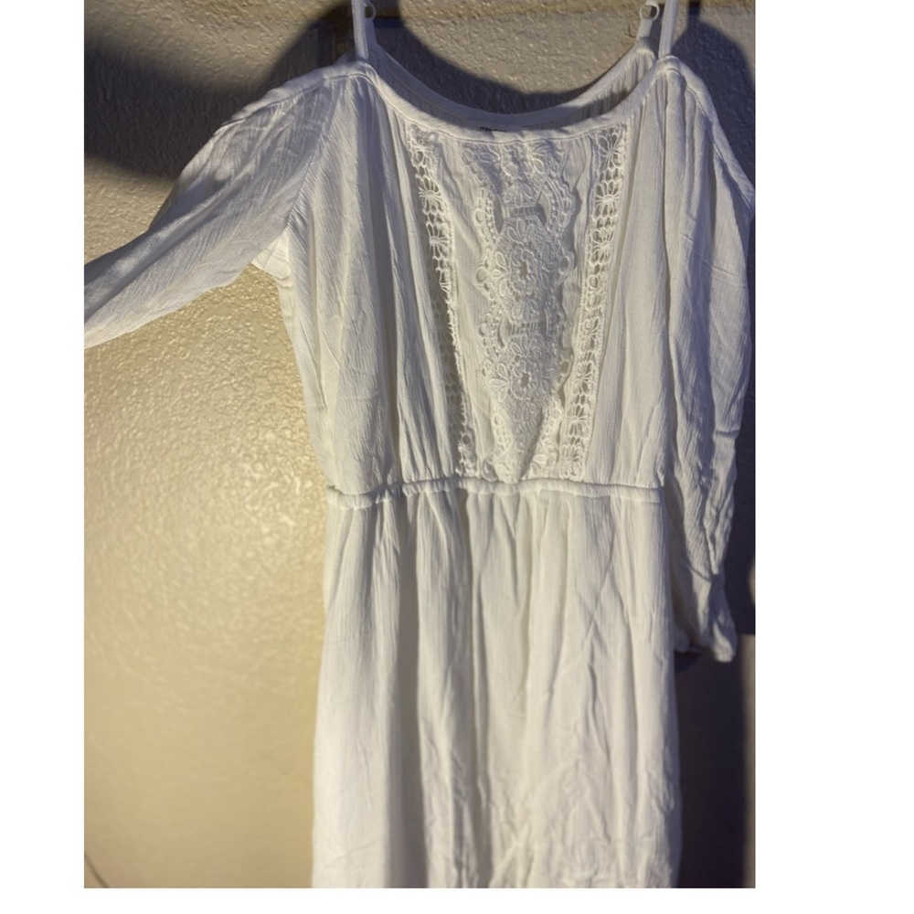 White over the shoulder dress with straps.